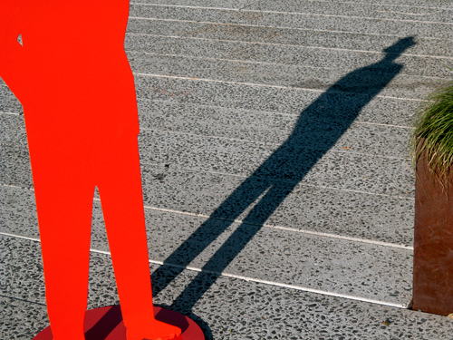 cast shadow of a man on the ground